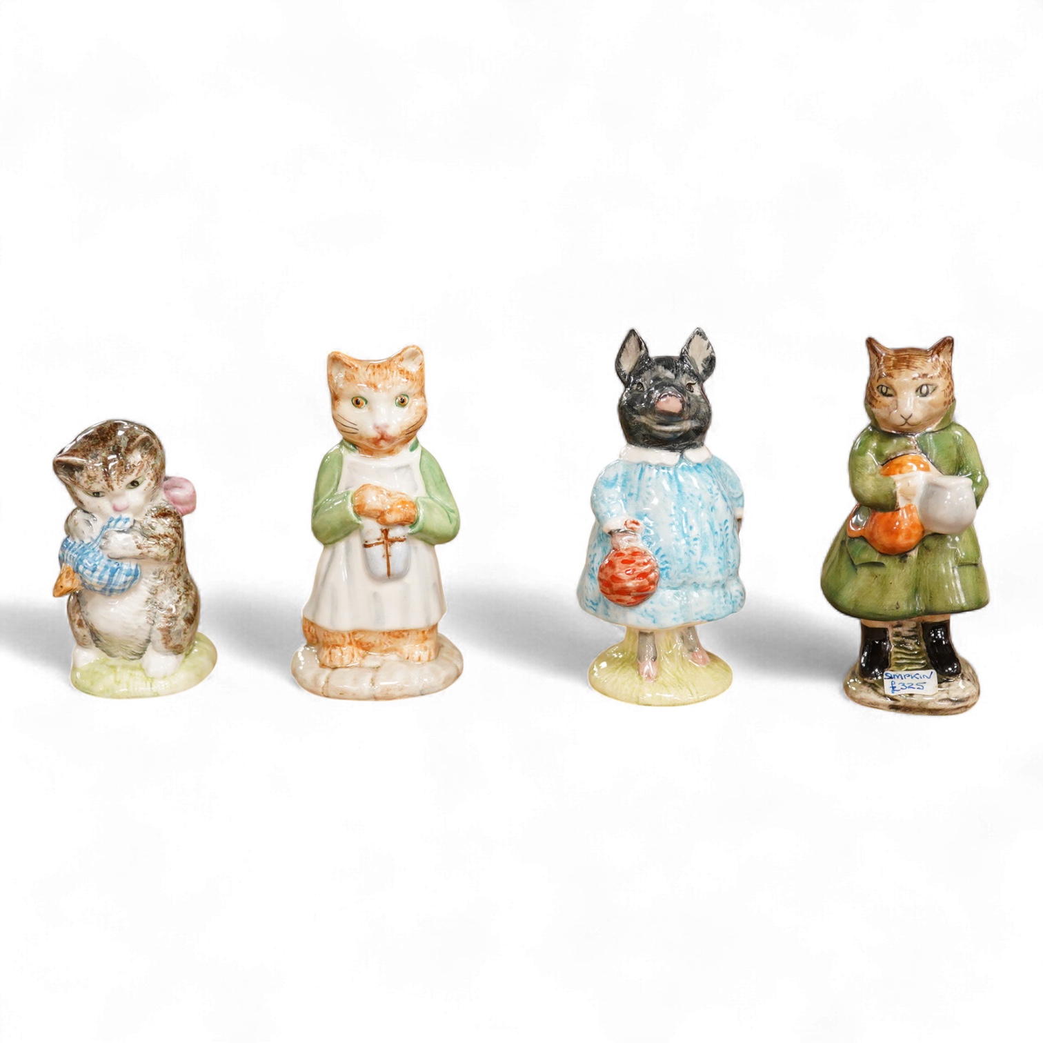 Four Beatrix Potter Beswick figures; Simpkin, Ginger, Miss Moppet and Pig-Wig, largest 10cm high